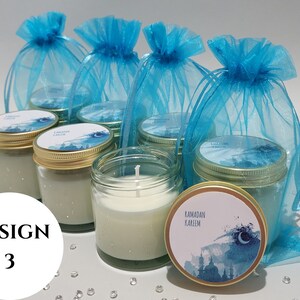 May include: Six teal blue organza bags filled with small glass jars with white candles. The jars have gold lids and a blue and white watercolor design with the text "Ramadan Kareem".