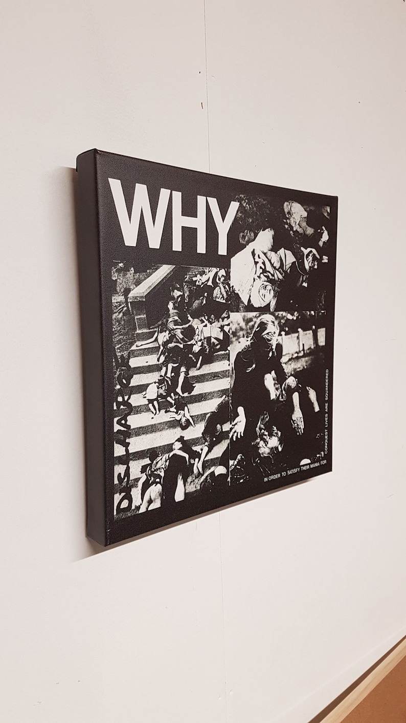 May include: Black and white canvas art piece with the word "WHY" in large, bold letters. The artwork features a collage of black and white images, with text that reads "CONQUEST LIVES ARE SQUANDERED IN ORDER TO SATISFY THEIR MANIA FOR".
