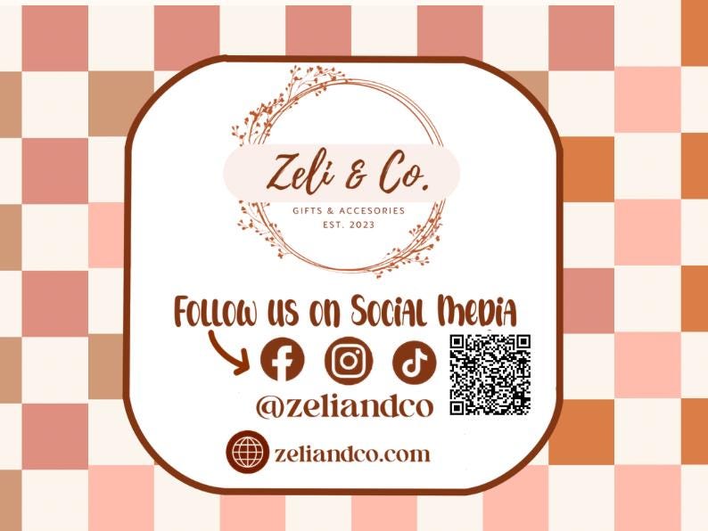 May include: A promotional graphic for Zeli & Co., featuring a white rounded rectangle with the company's logo and social media handles. The background has a checkered pattern in shades of brown and pink. The text includes "Gifts & Accessories" and "Est. 2023".