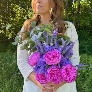 Unique bridal bouquet with lavender purple and fuchsia pink assorted flowers/greenery for a garden, outdoor, spring, summer, boho wedding.