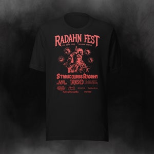 May include: Black t-shirt with a red graphic design featuring a character from the video game Elden Ring. The graphic includes the text "Radahn Fest", "Starscourse Radahn", "Tarnished", "Blaidd the Half-Wolf", "Lionel", "Okina", "Patches", and "Tarnished Legion".