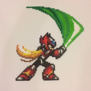 May include: A pixel art depiction of a red and black robot character holding a green crescent-shaped weapon. The robot has a yellow hair-like feature and a blue helmet.