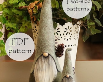 May include: Two felt gnomes, one large and one small, with gray beards and green hats. The gnomes are sitting on a brown surface. The text "PDF pattern" and "Two-size patterns" is visible in the image.