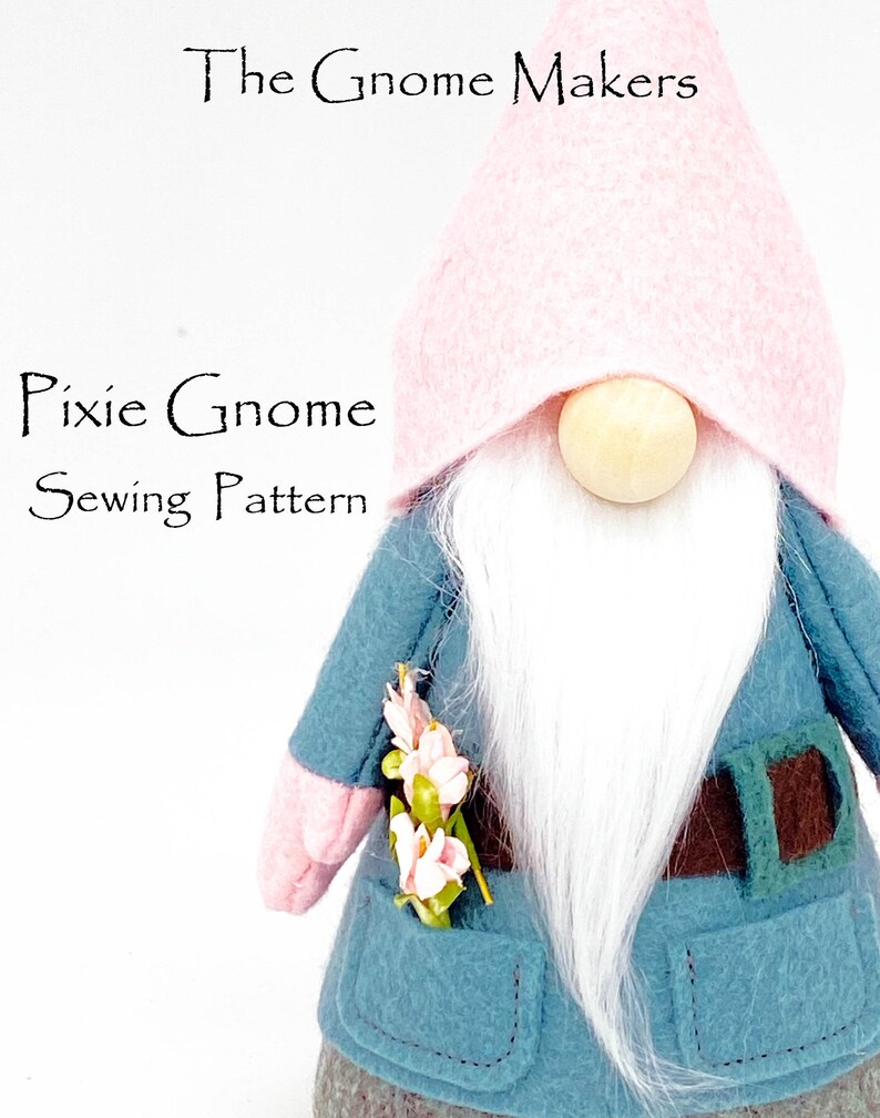 K&ouml;nnte beinhalten: Ein rosa-blaues N&auml;hmuster f&uuml;r einen Kobold-Zwerg. Der Zwerg tr&auml;gt einen rosa Hut, eine blaue Jacke mit einem braunen G&uuml;rtel und einen wei&szlig;en Bart. Der Zwerg h&auml;lt einen Strau&szlig; rosa Blumen in der Hand.