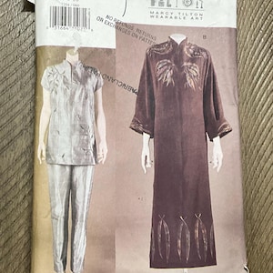 May include: A sewing pattern by Marcy Tilton, featuring two garment designs. One is a matching top and pants set, and the other is a long dress. The pattern size is 6-8-10.