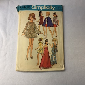 May include: Vintage Simplicity sewing pattern number 8466 for a dress, skirt, and pants. The pattern is for one size and costs 75 cents. The pattern features illustrations of women wearing the different garments.