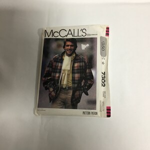 May include: A McCall's sewing pattern for a plaid jacket. The pattern number is 7302 and the price is $3.50. The pattern is for a medium size.
