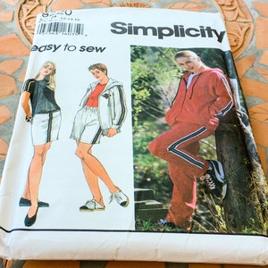 May include: Simplicity sewing pattern number 9320, easy to sew, featuring three different outfits. The first outfit is a black and white striped top with white shorts. The second outfit is a white jacket with a white and black striped top and white shorts. The third outfit is a red jacket with black and white striped trousers.