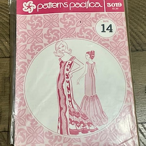 May include: A Patterns Pacifica sewing pattern envelope, number 3019, size 14. The packaging is pink and white with a repeating floral pattern. It features a line drawing of a floor-length gown with a flared hem and a bow detail on the back.