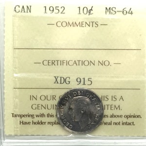 May include: A close-up of a 1952 Canadian 10-cent coin graded MS-64 by XDG, with a certification number of 915. The coin is in a plastic slab with a white label.