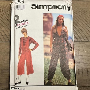 May include: A Simplicity sewing pattern package featuring two jumpsuit designs. The package has a white background with images of the finished garments. The text "2 Hour Express Collection" is visible.