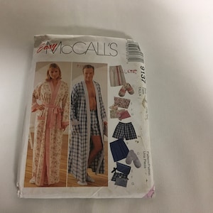 May include: A sewing pattern for a robe and shorts. The pattern is for sizes XS-XL and includes instructions for making both a men's and women's robe. The pattern is from McCall's Easy and is printed on a white background with a blue and pink design.