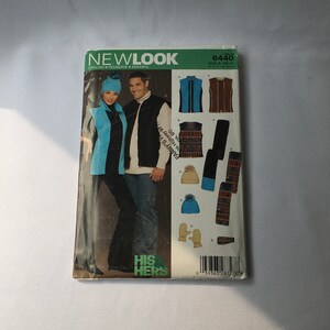 May include: A sewing pattern for a vest, scarf, hat, and mittens. The pattern is for sizes XS-XL and is from Newlook. The pattern is for a his and hers set. The pattern is for a vest, scarf, hat, and mittens. The pattern is for sizes XS-XL and is from Newlook. The pattern is for a his and hers set.