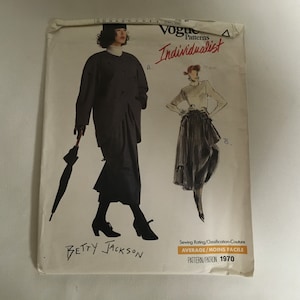 May include: A vintage Vogue sewing pattern for a skirt and jacket. The pattern is for an "Individualist" design by Betty Jackson. The pattern number is 1970. The sewing rating is "Average/Moins Facile".
