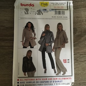 May include: A sewing pattern for a blouse with a plaid design, a jacket with a textured design, and a pair of pants. The pattern is from Burda and has the number 7748. The text "FINAL SALE" is printed on the pattern.