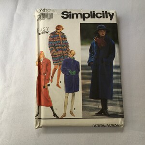 May include: Simplicity sewing pattern for a coat. The pattern shows three different styles of coats, one with a colorful geometric print, one in a solid blue, and one in a solid red. The pattern is labeled "Easy to Sew" and "Pattern/Patron".