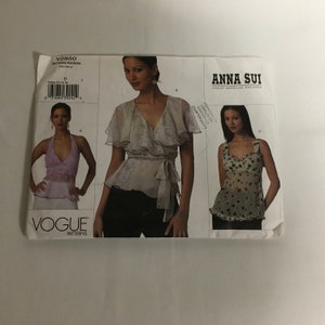 May include: A sewing pattern for three tops designed by Anna Sui. The pattern is for a halter top, a wrap top, and a sleeveless top. The pattern is from Vogue Patterns.