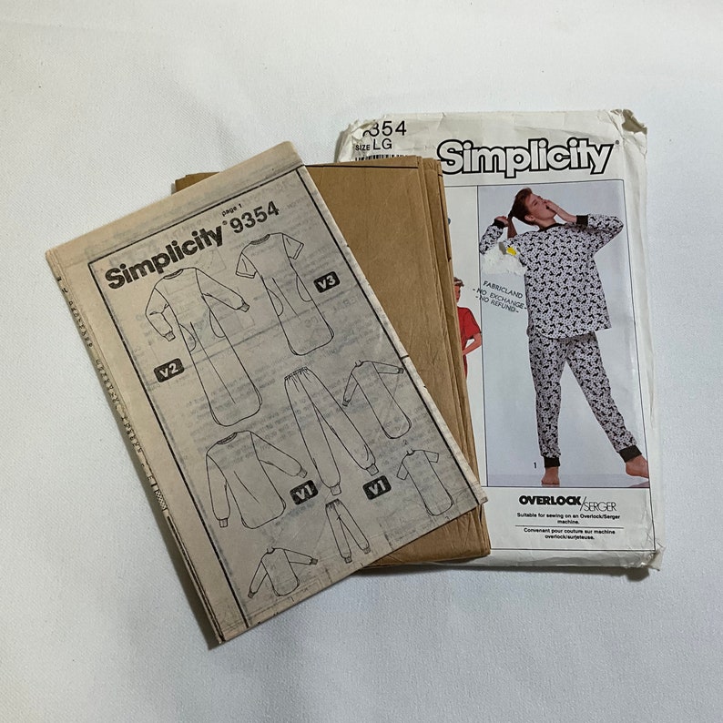 May include: Simplicity sewing pattern number 9354 for a long-sleeved pyjama top and trousers. The pattern includes three variations, with a black and white animal print design shown on the front of the pattern envelope.
