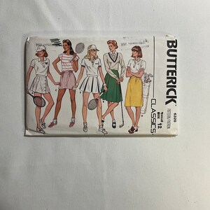 May include: A vintage sewing pattern for women's skirts. The pattern is for sizes 12 and includes five different skirt styles. The pattern is from Butterick Classics and has the pattern number 6320.