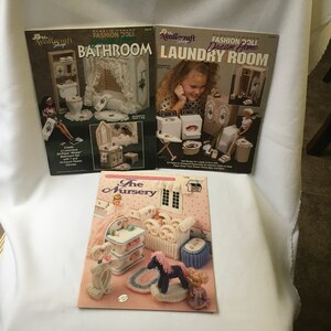 May include: Three craft books with colourful covers featuring miniature dollhouse furniture. The books are titled "Bathroom", "Laundry Room", and "The Nursery".