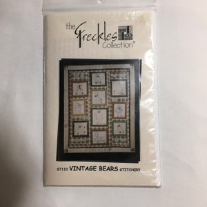 May include: A craft pattern packet titled The Freckles Collection ST110 Vintage Bears Stitchery. The cover features a quilt design with multiple squares containing line drawings of teddy bears, surrounded by text reading The Hug of a Teddy Bear is Special Forever.