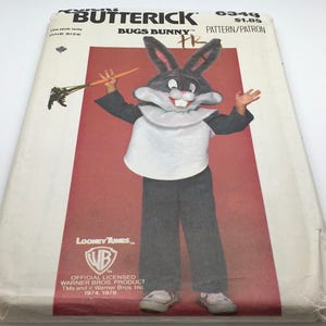 May include: A vintage sewing pattern for a Bugs Bunny costume. The pattern is from Butterick and is for a child's size. The pattern includes instructions and illustrations for making the costume. The pattern is from 1974-1978 and is officially licensed by Warner Bros.