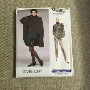 May include: A vintage sewing pattern for a black and white leopard print top and trousers. The pattern is from Vogue Patterns, Paris Original, and is labelled "Easy/Facile". The pattern number is 1973.