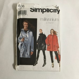 May include: Simplicity pattern 8536, Millennium by Simplicity, for a long coat with pockets. The pattern shows three different versions of the coat: a silver coat, a black coat, and a red coat.