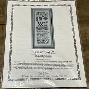 May include: A cross-stitch pattern sheet titled THE TRINITY SAMPLER, featuring a long band design with various geometric motifs and the verse from the breastplate of St. Patrick. The document includes stitch instructions and measures 4 by 13 inches.