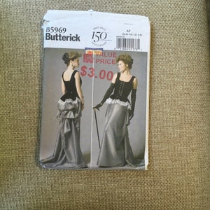 May include: A vintage sewing pattern for a long, grey dress with a black corset. The pattern is from Butterick and is for sizes 6-8-10-12-14. The pattern is priced at £3.00.