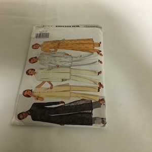 May include: A vintage Butterick Classics sewing pattern packet. The packet shows illustrations of outfits, including long coats and trouser suits. The outfits are in shades of yellow, white, and black. The packet has the numbers 14, 16, and 18 on the front.