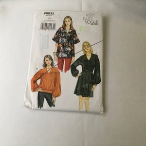 May include: A sewing pattern for a blouse with three different styles. The pattern is from Vogue Patterns and is labelled "Very Easy".