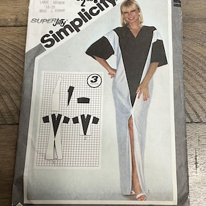 May include: A vintage Simplicity sewing pattern, featuring a woman modeling a color-blocked dress. The pattern includes diagrams and the text "Simplicity", "9919", "LARGE GRANDE 18-20", and "MISS J. FEMME". The pattern is for 3 pieces.