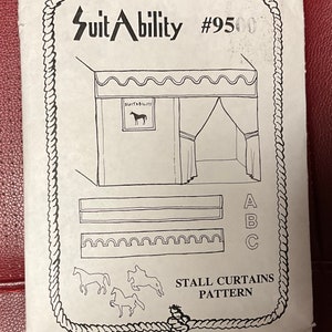 May include: A white paper pattern for stall curtains. The pattern includes illustrations of the curtains, a horse, and the text "Suit Ability" and "Stall Curtains Pattern". The pattern is enclosed in a rope-like border.