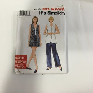 May include: A sewing pattern featuring two women's sleeveless tops. The top on the left is a patterned vest with a skirt. The top on the right is a white vest with blue pants. The pattern is titled "It's SO EASY it's Simplicity".