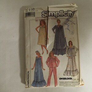 May include: Simplicity sewing pattern number 310 for a dress and a pajama set. The pattern shows three different styles of dresses and a pajama set. The pattern is printed on a white background with black text. The pattern is for sizes AA (FT-LO).