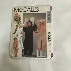 May include: McCall's sewing pattern number 9233 size 2 for a children's costume. The pattern includes instructions for making a tiger, bunny, and dog costume. The pattern is $4.70.