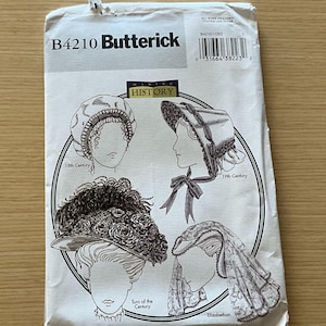 Op de afbeelding: Een vintage Butterick naaipatroon, met illustraties van historische hoofddeksels uit de 18e, 19e en vroege 20e eeuw. Het patroon bevat ontwerpen voor mutsen en hoeden, met het woord "HISTORY" prominent weergegeven.