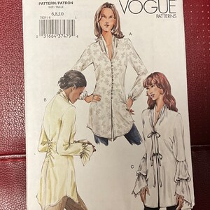 May include: Vogue sewing pattern number V7829 for sizes 6, 8, and 10. The pattern includes three different styles of blouses with long sleeves and a variety of necklines. The pattern is printed on white paper with black text and illustrations.