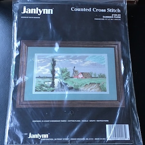 May include: Counted cross stitch pattern for a summer farm scene. The pattern includes a farmhouse, trees, a windmill, and a river. The finished size is 12" x 18".