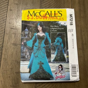 May include: A sewing pattern for a peacock costume. The pattern is for sizes 6-8-10-12-14. The pattern is from McCall's and costs $3.00. The pattern features a woman wearing a teal and green peacock costume.