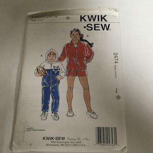 May include: Sewing pattern for a red and white jacket and skirt for a girl and a blue and white jacket and pants for a boy. The pattern is called Kwik Sew and the pattern number is 2474. The sizes are 4-5-6-7.