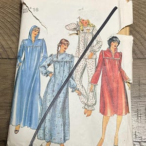 May include: Vintage Butterick pattern envelope featuring illustrations of sleepwear designs. The designs include a blue hooded robe, a blue floral nightgown, a floral pajama set, and a red robe. The envelope is torn and shows the size 16.