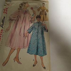May include: Vintage sewing pattern for a long, pink nightgown with lace trim and a blue and white patterned robe. The pattern number is 4972, size 12, bust 30.