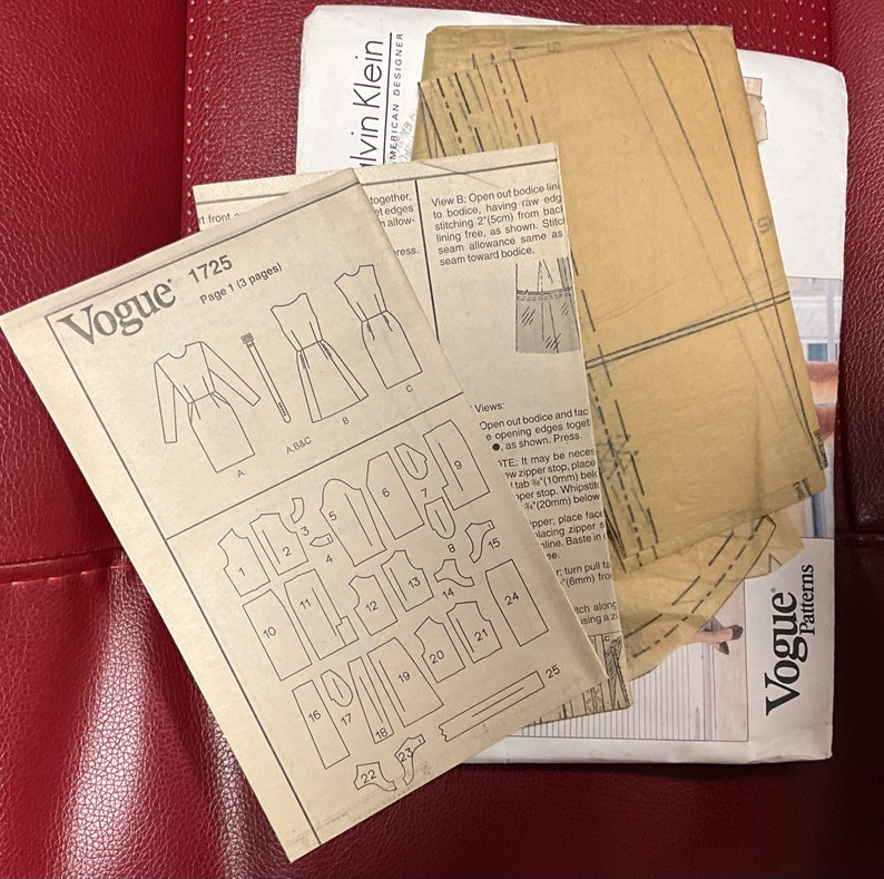 May include: A vintage Vogue sewing pattern for a dress, with instructions and diagrams for cutting and assembling the garment. The pattern is for size 1725 and includes a basic dress and a bodice.
