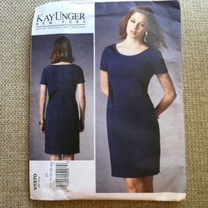 May include: A sewing pattern for a navy blue dress with short sleeves and a scoop neck. The pattern is from Vogue Patterns and is designed by Kay Unger New York. The pattern number is V1370 and the sizes are 16-18-20-22-24.