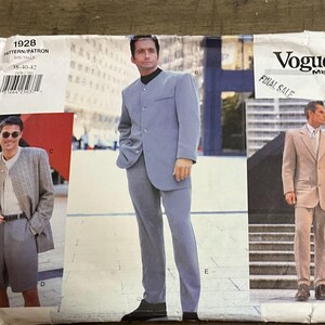 May include: Vogue Men sewing pattern 1928 featuring designs for a blazer and trousers. The envelope displays three variations of jackets and pants in light blue, tan, and a grey plaid pattern, with size range 38-40-42 printed on the front.