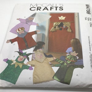May include: A sewing pattern for making a puppet theater and five puppets. The puppets include a king, a jester, a frog, a princess, and a wizard. The pattern is from McCall's Crafts and has the number M4796.