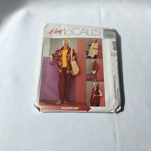 May include: A sewing pattern for a sleeveless vest, a long-sleeved shirt, and a pair of pants. The pattern is from McCall's Easy Nonstop Wardrobe and is size E (14-10-18).