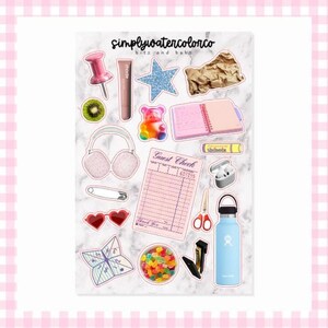 May include: A collection of stickers featuring various objects, including a push pin, lipstick, a glittery star, a gummy bear, a notebook, headphones, a safety pin, heart-shaped sunglasses, a guest check, scissors, a water bottle, and a bowl of candy. The stickers are on a marble background.